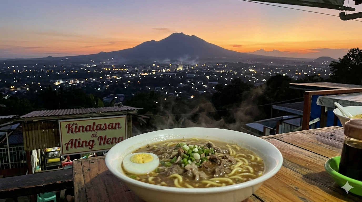 Bowl of kinalas noodle soup with beef, broth, and miki noodles on a wooden table